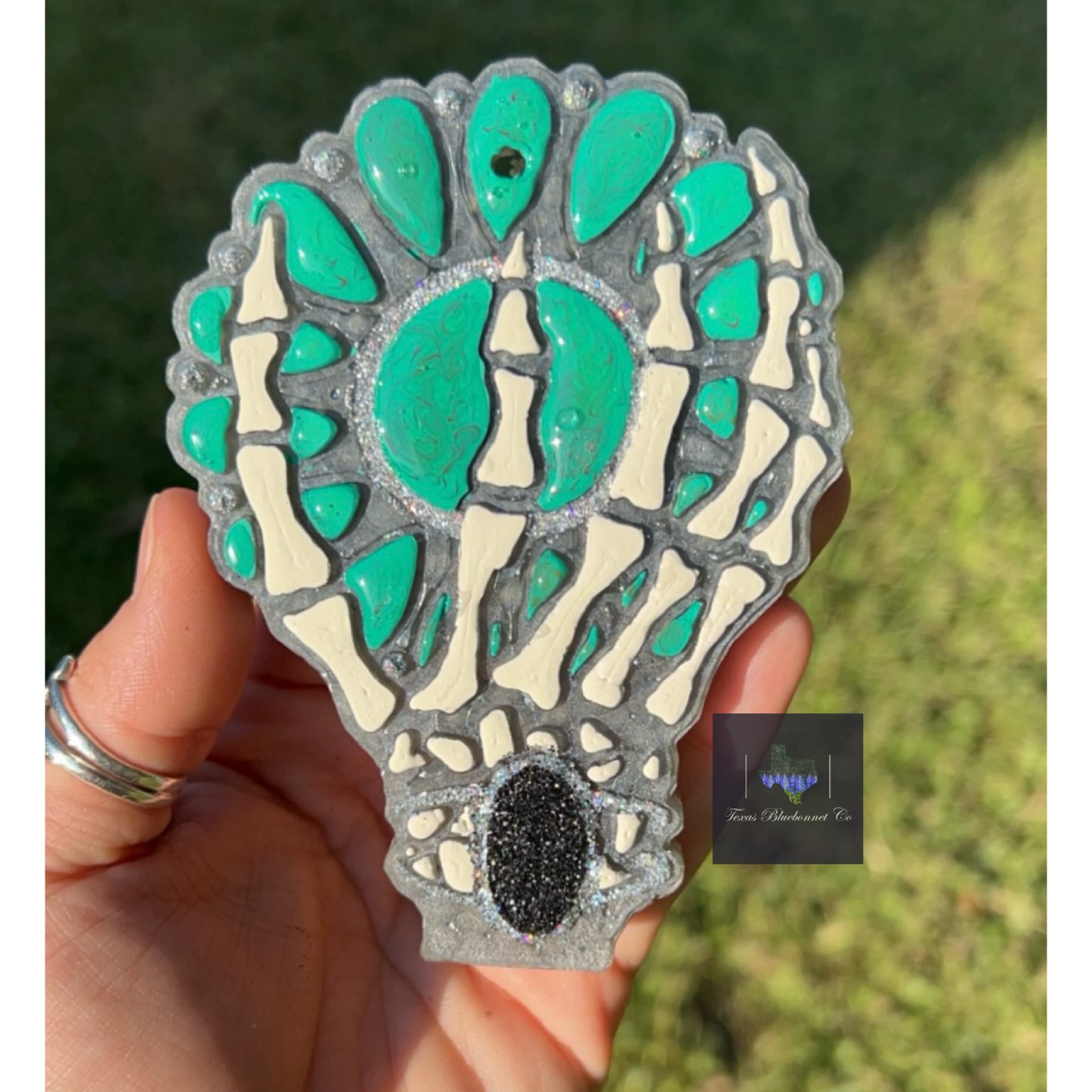 SKELETON HAND HOLDING TURQUOISE